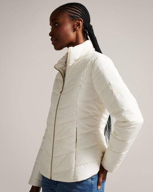 RENIKA-Outerwear-Don't let the weather catch you off guard. RENIKA's showerproof design ensures you stay dry in the unpredictable British weather, and it's easy to carry with its convenient packaway drawstring pouch. Padded jacket Showerproof Packaway drawstring pouch Zip fastening Funnel neck Long sleeves Awuoi is 5'10.5" / 1.79m and wears Black in a Ted size 1- Ted Baker Romania